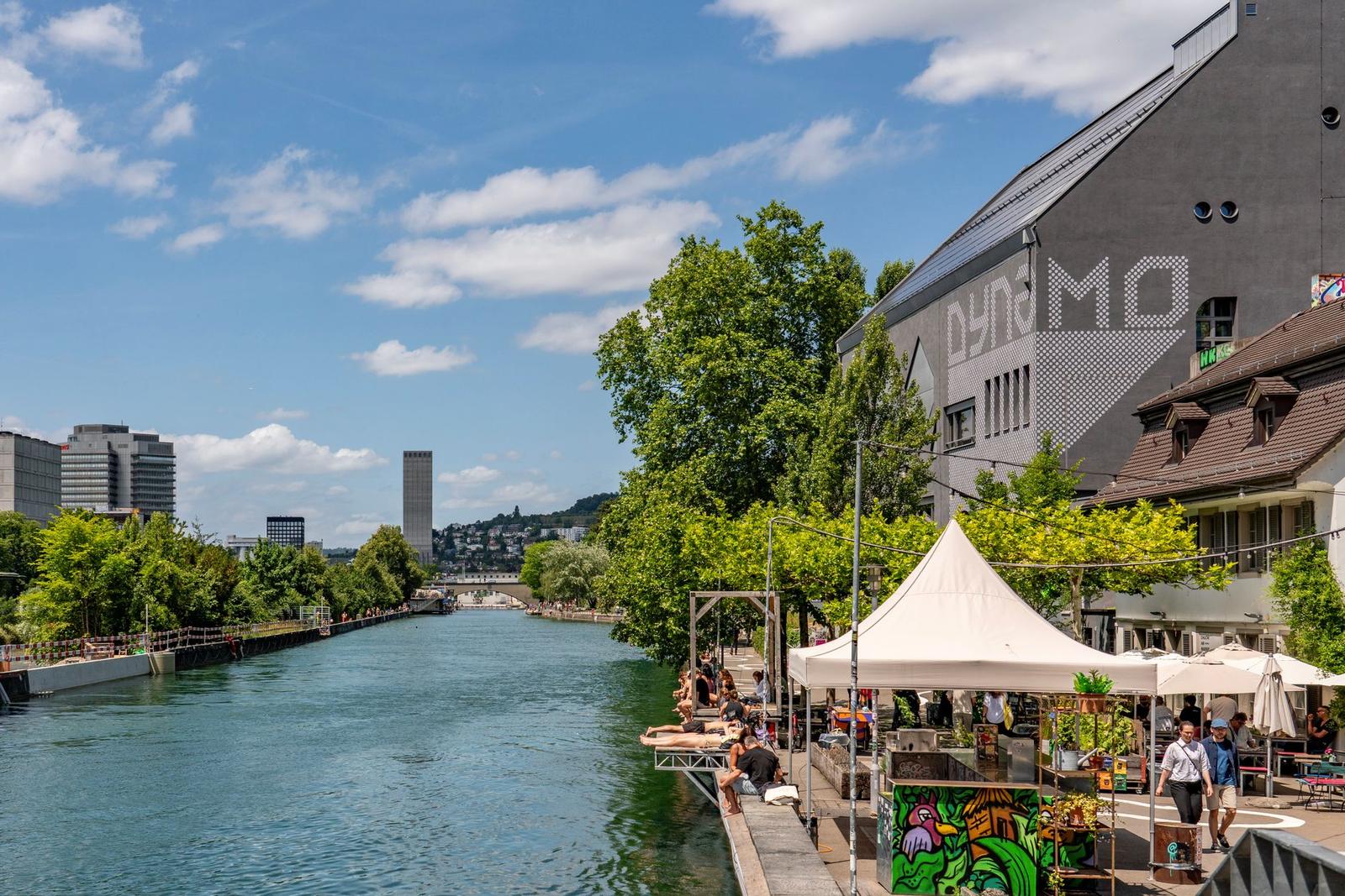 Zurich's Summer Peak: Locals Flock to Limmat Banks as Historic Venues Reopen